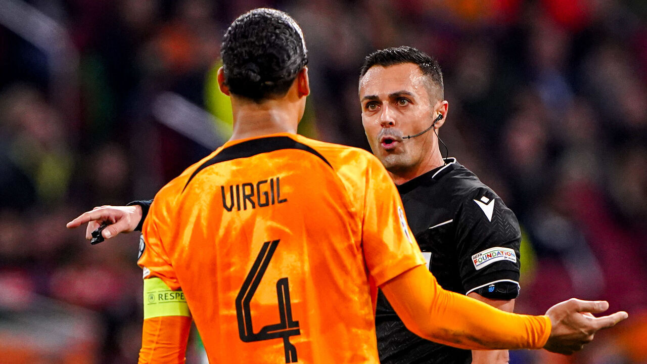 AMSTERDAM, NETHERLANDS - NOVEMBER 18: Virgil van Dijk of The Netherlands in discussion with referee Marco Di Bello during the UEFA EURO 2024 Qualifying Round Group B match between Netherlands and Republic of Ireland at Johan Cruijff ArenA on November 18, 2023 in Amsterdam, Netherlands