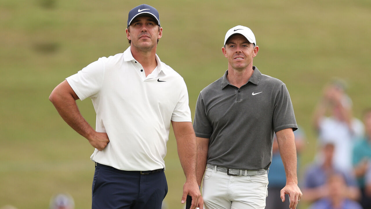 LOS ANGELES, CALIFORNIA - JUNE 15: Brooks Koepka of the United States and Rory McIlroy of Northern Ireland on the 11th green during the first round of the 123rd U.S. Open Championship at The Los Angeles Country Club on June 15, 2023 in Los Angeles, California.
