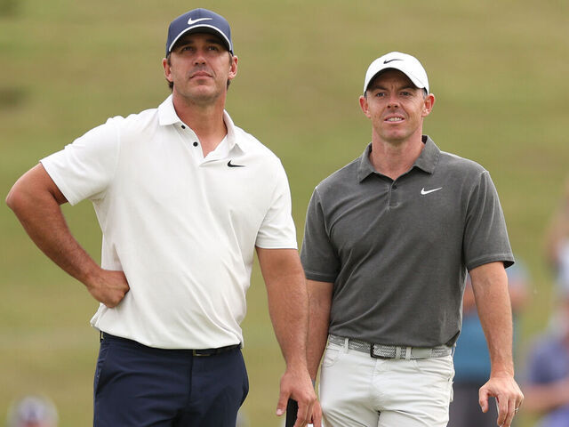 LOS ANGELES, CALIFORNIA - JUNE 15: Brooks Koepka of the United States and Rory McIlroy of Northern Ireland on the 11th green during the first round of the 123rd U.S. Open Championship at The Los Angeles Country Club on June 15, 2023 in Los Angeles, California.