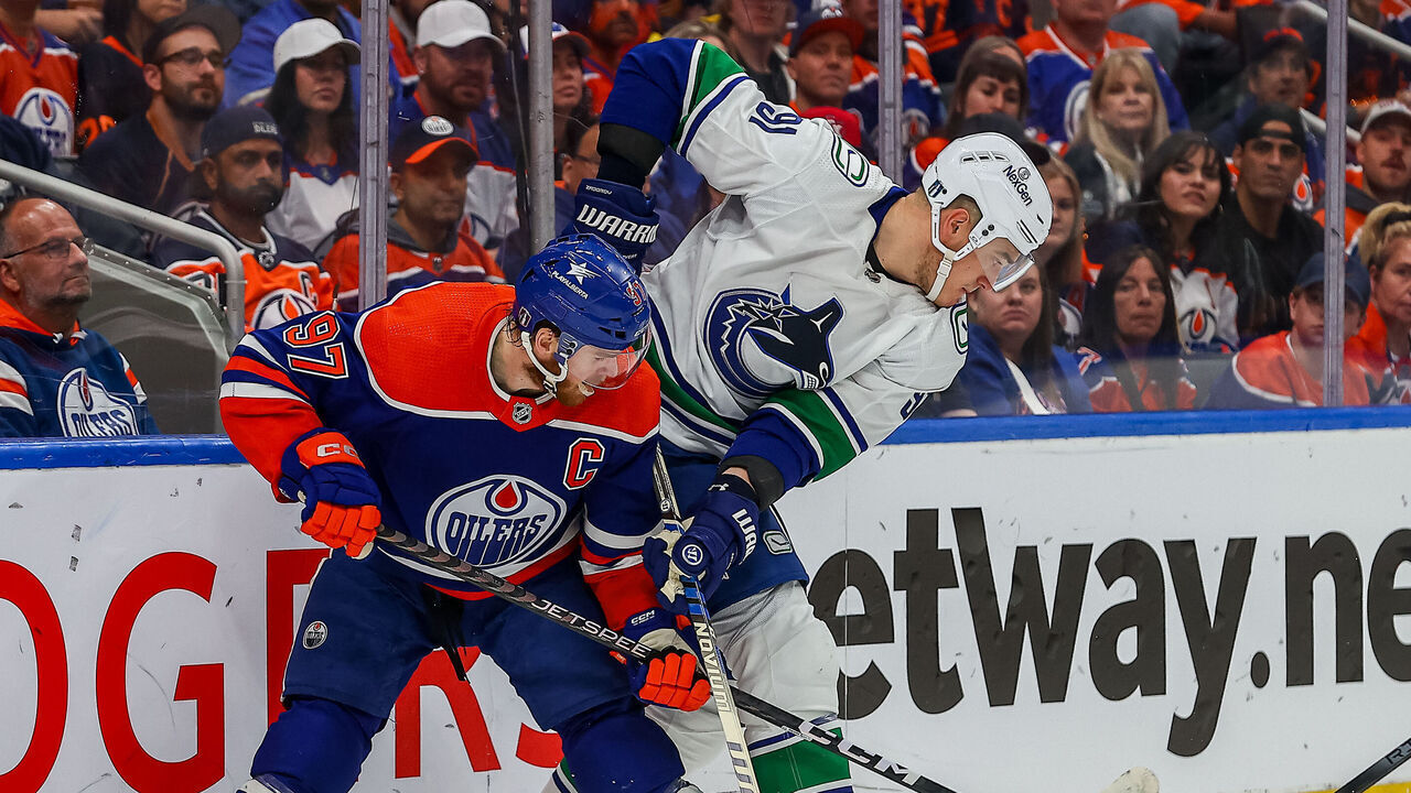 EDMONTON, AB - MAY 12: Edmonton Oilers Center Connor McDavid (97) checks Vancouver Canucks Defenceman Nikita Zadorov (91) in the first period of game five of the Western Conference Second Round Edmonton Oilers game versus the Vancouver Canucks on May 12, 2024 at Rogers Place in Edmonton, AB.
