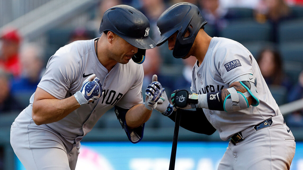 MINNEAPOLIS, MINNESOTA - MAY 14: Giancarlo Stanton #27 of the New York Yankees celebrates his solo home run with teammate Gleyber Torres #25 in the third inning against the Minnesota Twins at Target Field on May 14, 2024 in Minneapolis, Minnesota.