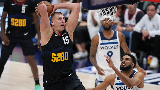 DENVER, CO - MAY 14: Nikola Jokic #15 of the Denver Nuggets dunks the ball during the game against the Minnesota Timberwolves during Round 2 Game 5 of the 2024 NBA Playoffs on May 14, 2024 at the Ball Arena in Denver, Colorado. NOTE TO USER: User expressly acknowledges and agrees that, by downloading and/or using this Photograph, user is consenting to the terms and conditions of the Getty Images License Agreement. Mandatory Copyright Notice: Copyright 2024 NBAE