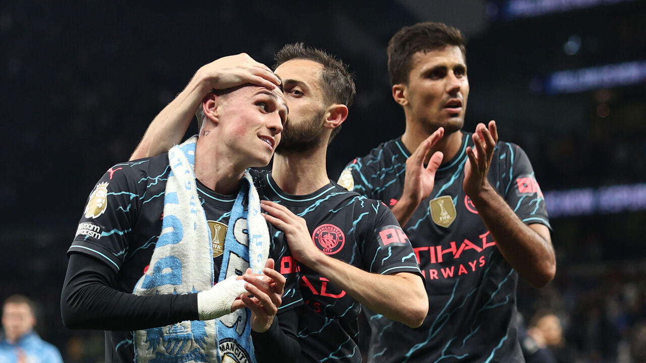 LONDON, ENGLAND - MAY 14: Phil Foden and Bernardo Silva of Manchester City celebrate after the team's victory in the Premier League match between Tottenham Hotspur and Manchester City at Tottenham Hotspur Stadium on May 14, 2024 in London, England.