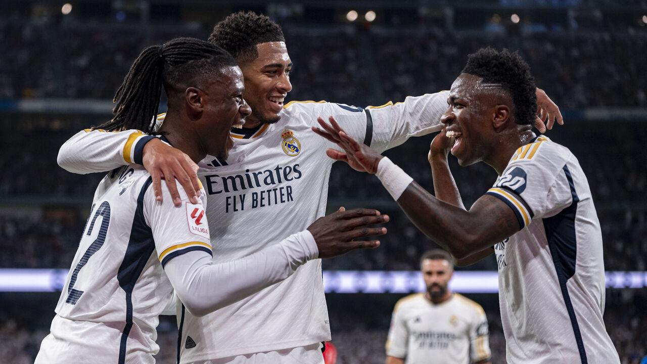 Eduardo Camavinga (L), Jude Bellingham (C), and Vinicius Junior (R) of Real Madrid are celebrating a goal during the La Liga EA Sports 2023/24 football match between Real Madrid and Deportivo Alaves at Estadio Santiago Bernabeu in Madrid, Spain, on May 14, 2024.
