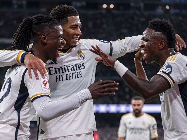 Eduardo Camavinga (L), Jude Bellingham (C), and Vinicius Junior (R) of Real Madrid are celebrating a goal during the La Liga EA Sports 2023/24 football match between Real Madrid and Deportivo Alaves at Estadio Santiago Bernabeu in Madrid, Spain, on May 14, 2024.