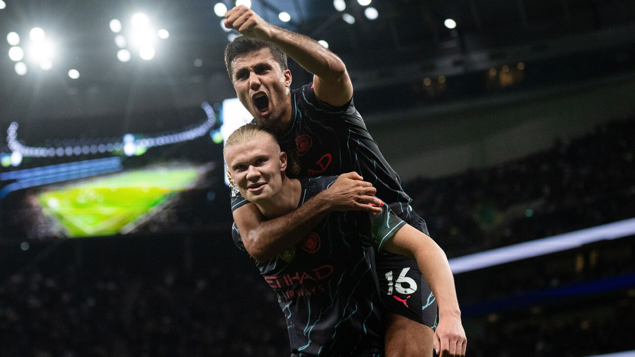 LONDON, ENGLAND - MAY 14: Erling Haaland of Manchester City celebrates with Rodri after scoring their second goal from the penalty spot during the Premier League match between Tottenham Hotspur and Manchester City at Tottenham Hotspur Stadium on May 14, 2024 in London, England.