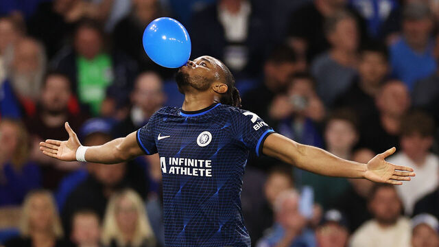 BRIGHTON, ENGLAND - MAY 15: Christopher Nkunku of Chelsea celebrates scoring his team's second goal with a balloon during the Premier League match between Brighton & Hove Albion and Chelsea FC at American Express Community Stadium on May 15, 2024 in Brighton, England.