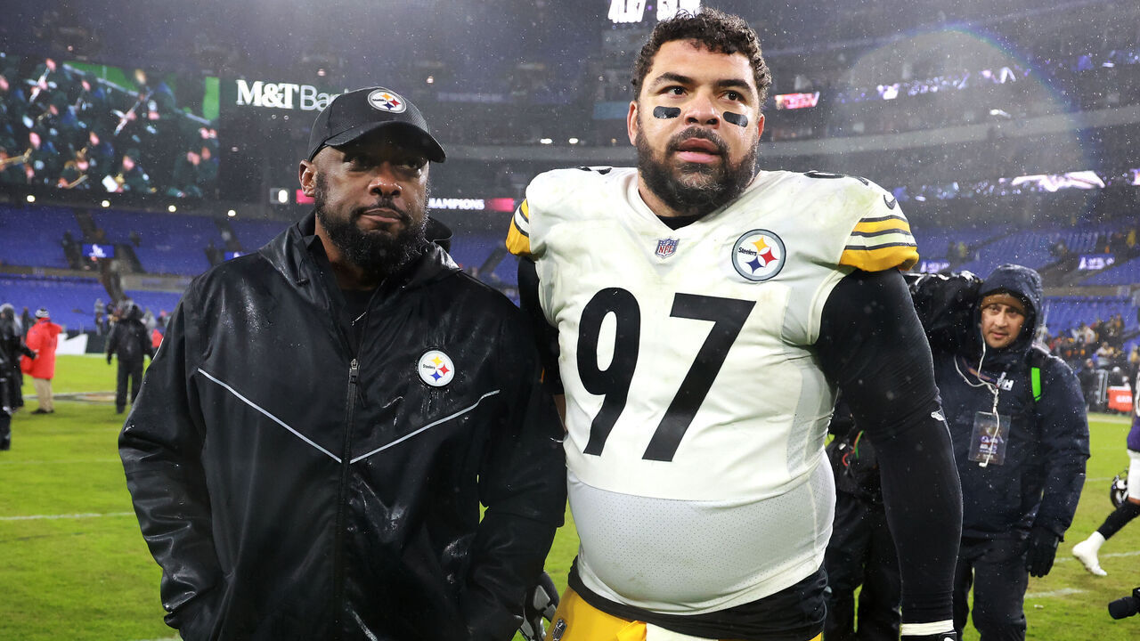 BALTIMORE, MARYLAND - JANUARY 06: Pittsburgh Steelers head coach Mike Tomlin leaves the field with defensive tackle Cameron Heyward #97 following the Steelers win over the Baltimore Ravens game at M&T Bank Stadium on January 06, 2024 in Baltimore, Maryland.