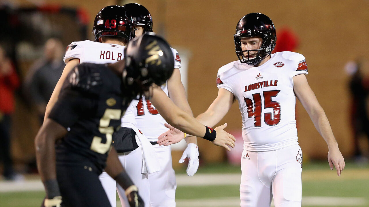 WINSTON SALEM, NC - OCTOBER 30: John Wallace #45 of the Louisville Cardinals reacts after kicking a field goal in the third quarter to give the Cardinals a 20-19 lead during their game at BB&T Field on October 30, 2015 in Winston Salem, North Carolina.