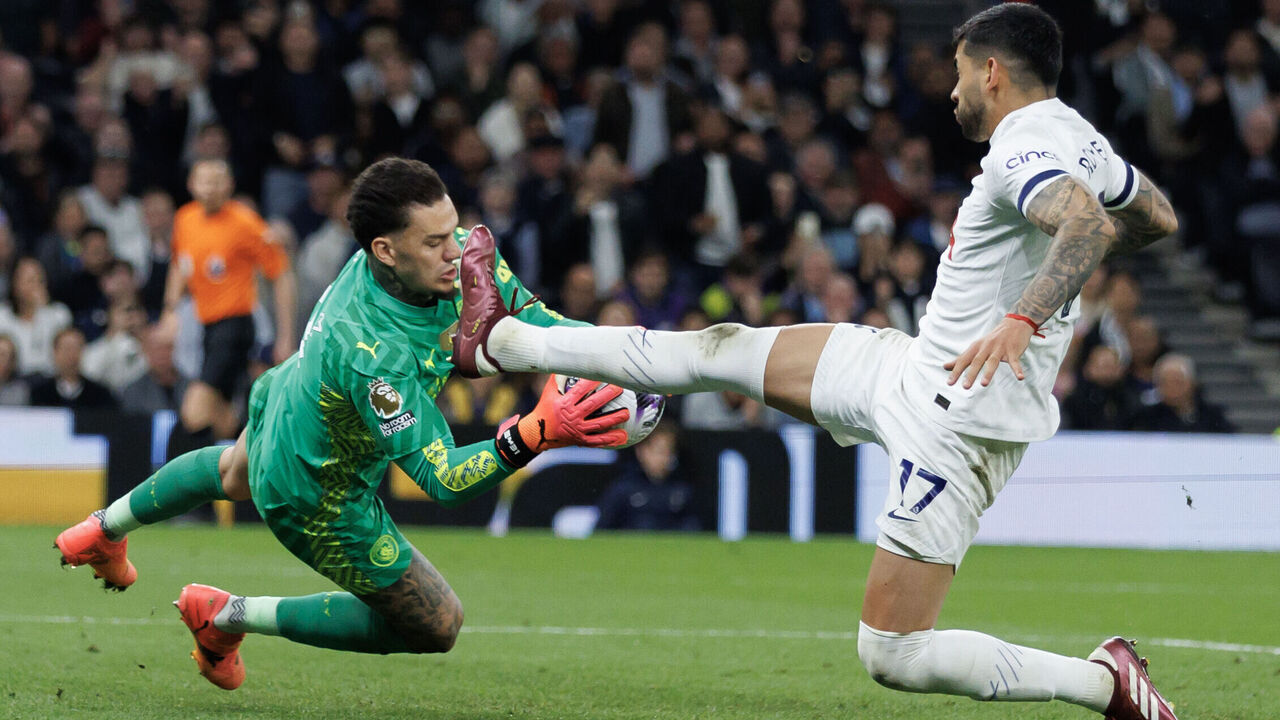 LONDON, ENGLAND - MAY 14: Cristian Romero of Tottenham Hotspur collides with Ederson of Manchester City during the Premier League match between Tottenham Hotspur and Manchester City at Tottenham Hotspur Stadium on May 14, 2024 in London, England.
