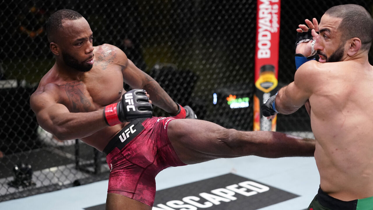 LAS VEGAS, NEVADA - MARCH 13: (L-R) Leon Edwards of Jamaica kicks Bulal Muhammad in a welterweight fight during the UFC Fight Night event at UFC APEX on March 13, 2021 in Las Vegas, Nevada.