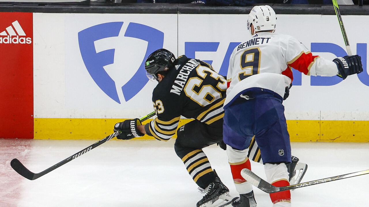 Boston, MA - May 10: Boston Bruins LW Brad Marchand was injured on this play as he is checked by Florida Panthers center Sam Bennett in the first period.