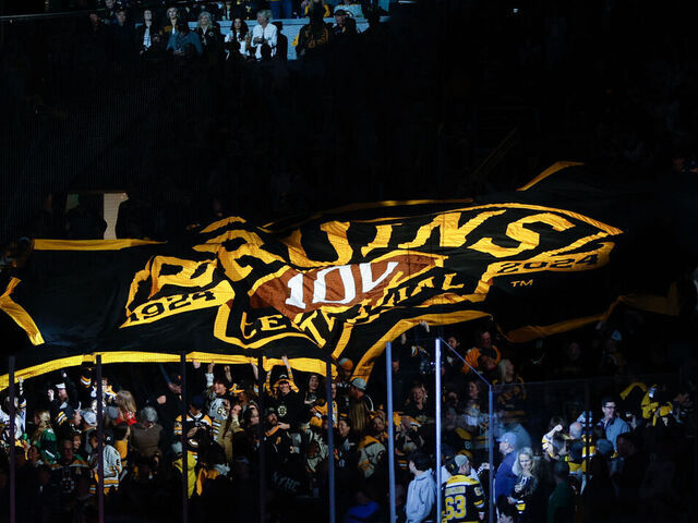 BOSTON, MASSACHUSETTS - MAY 12: A large Boston Bruins 100th anniversary centennial flag makes its way over a group of fans before a game against the Florida Panthers before Game Four of the Second Round of the 2024 Stanley Cup Playoffs at the TD Garden on May 12, 2024 in Boston, Massachusetts. The Panthers won 3-2.