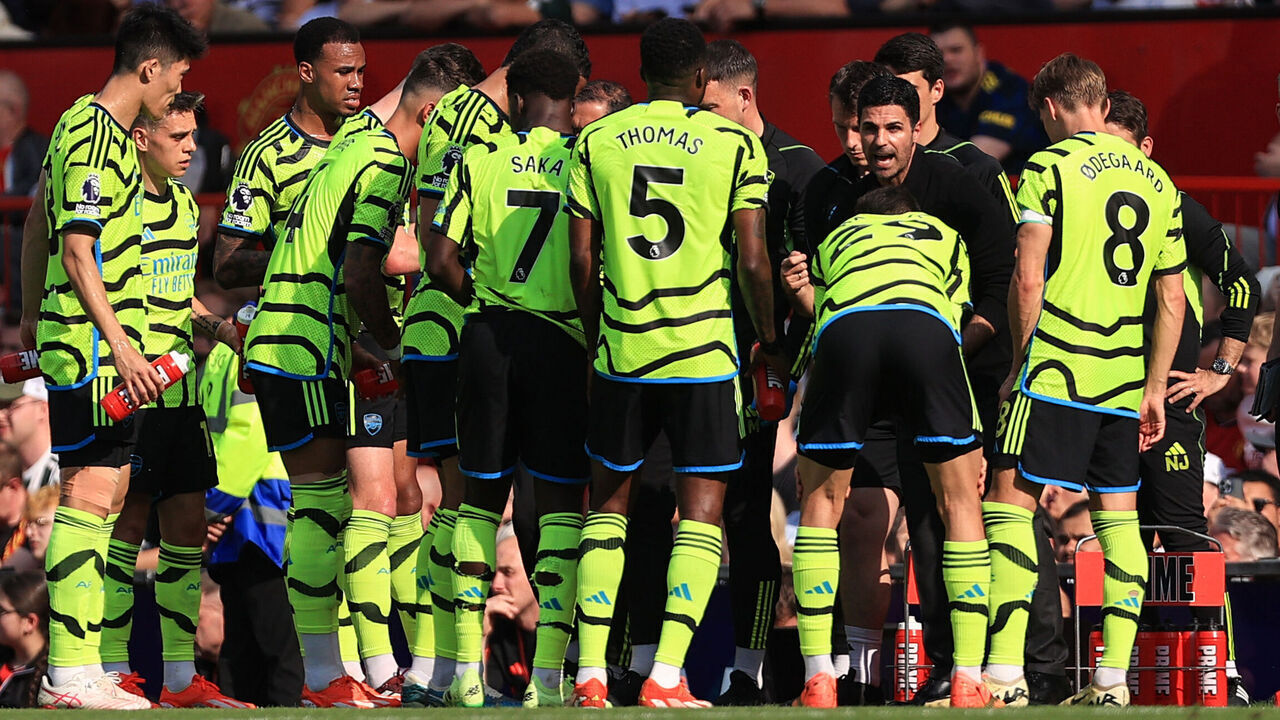 MANCHESTER, ENGLAND - MAY 12: Arsenal manager Mikel Arteta gives a team talk on the side line during the Premier League match between Manchester United and Arsenal FC at Old Trafford on May 12, 2024 in Manchester, England.