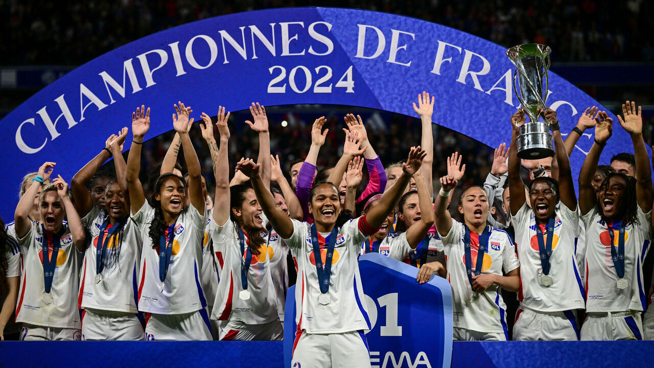 Olympique Lyonnais players celebrate after being crowned French Women's D1 Champions at the end of the D1 Women's football match between Lyon (OL) and Paris (PSG) at the Groupama Stadium in Decines-Charpieu, central-eastern France, on May 17, 2024.