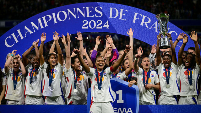 Olympique Lyonnais players celebrate after being crowned French Women's D1 Champions at the end of the D1 Women's football match between Lyon (OL) and Paris (PSG) at the Groupama Stadium in Decines-Charpieu, central-eastern France, on May 17, 2024.