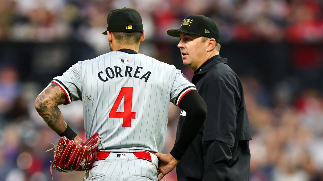 CLEVELAND, OH - MAY 17: Minnesota Twins shortstop Carlos Correa (4) talks to umpire Lance Barrett (16) after being called for a shift violation during the sixth inning of the Major League Baseball game between the Minnesota Twins and Cleveland Guardians on May 17, 2024, at Progressive Field in Cleveland, OH.
