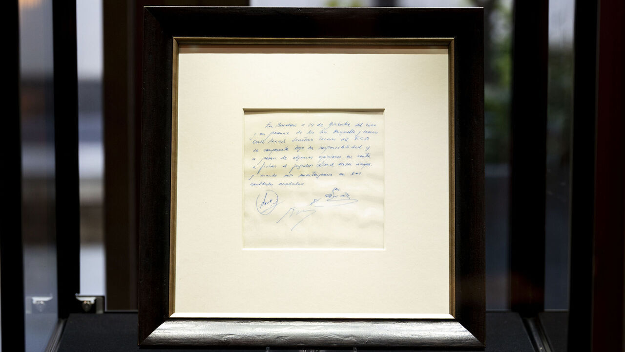 A napkin on which a written commitment was made to Lionel Messi, when he was 13-years-old, for a contract from FC Barcelona in December 2000, on display at Bonhams in London before it is offered at auction. Picture date: Wednesday May 8, 2024.