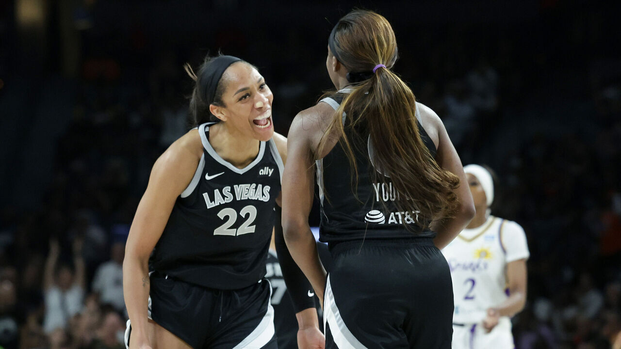 LAS VEGAS, NEVADA - MAY 18: A'ja Wilson #22 of the Las Vegas Aces reacts after her teammate Jackie Young #0 hit a 3-pointer against the Los Angeles Sparks with less than 20 second left in the fourth quarter of their game at Michelob ULTRA Arena on May 18, 2024 in Las Vegas, Nevada. The Aces defeated the Sparks 89-82.