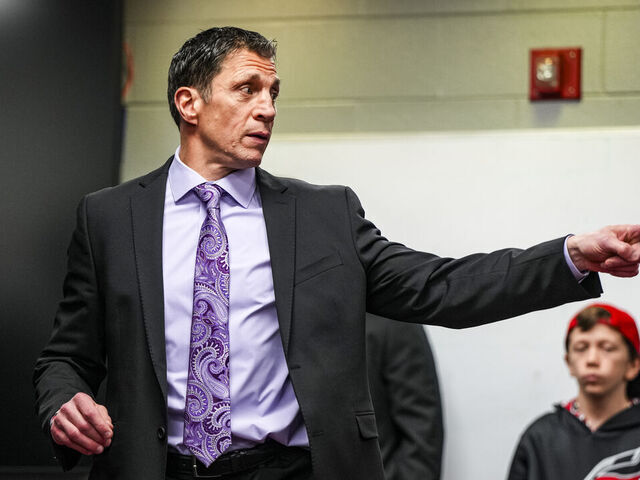 RALEIGH, NORTH CAROLINA - MARCH 21: Carolina Hurricanes head coach Rod Brind'Amour talks in the locker room after an NHL hockey game against the Philadelphia Flyers at PNC Arena on March 21, 2024 in Raleigh, North Carolina.