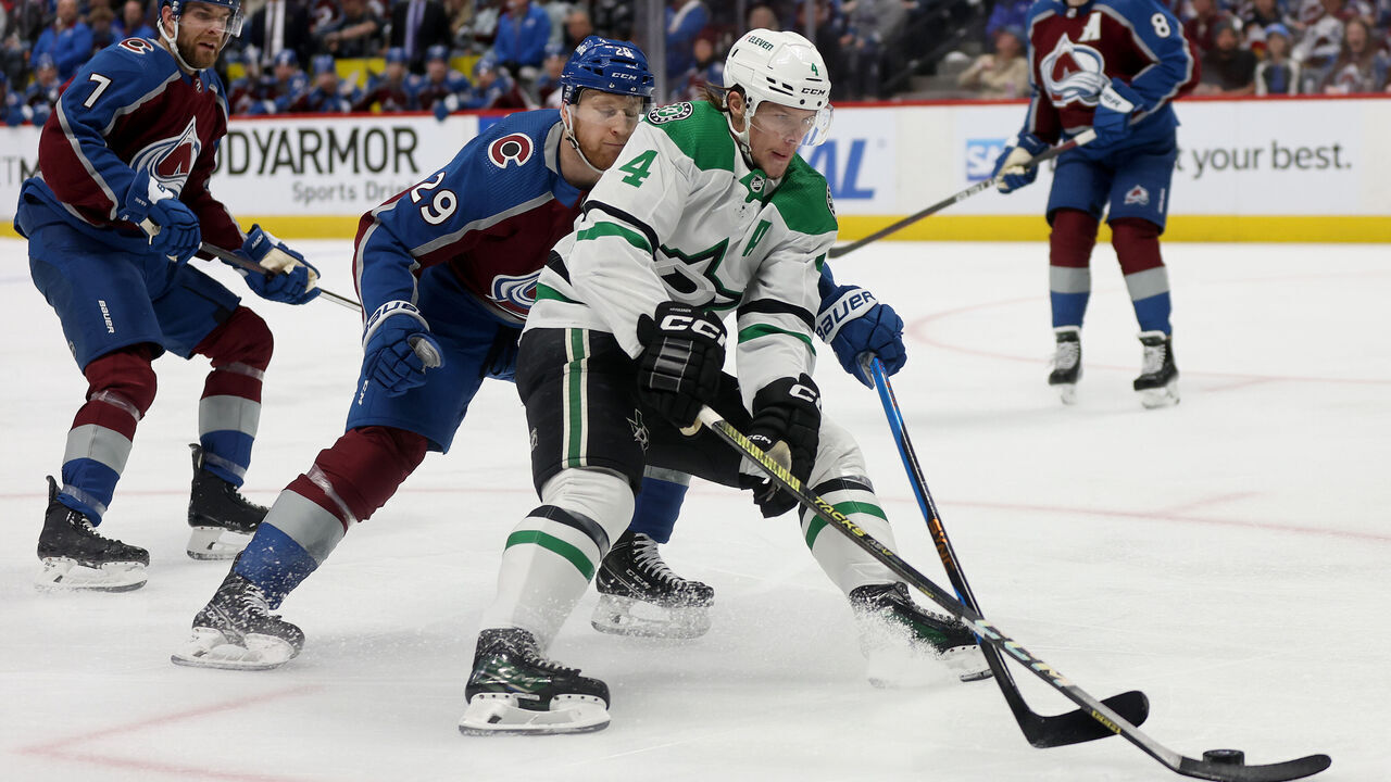 DENVER, COLORADO - MAY 11: Miro Heiskanen #4 advances the puck against Nathan MacKinnon #29 of the Colorado Avalanche in the first period during Game Three of the Second Round of the 2024 Stanley Cup Playoffs at Ball Arena on May 11, 2024 in Denver, Colorado.