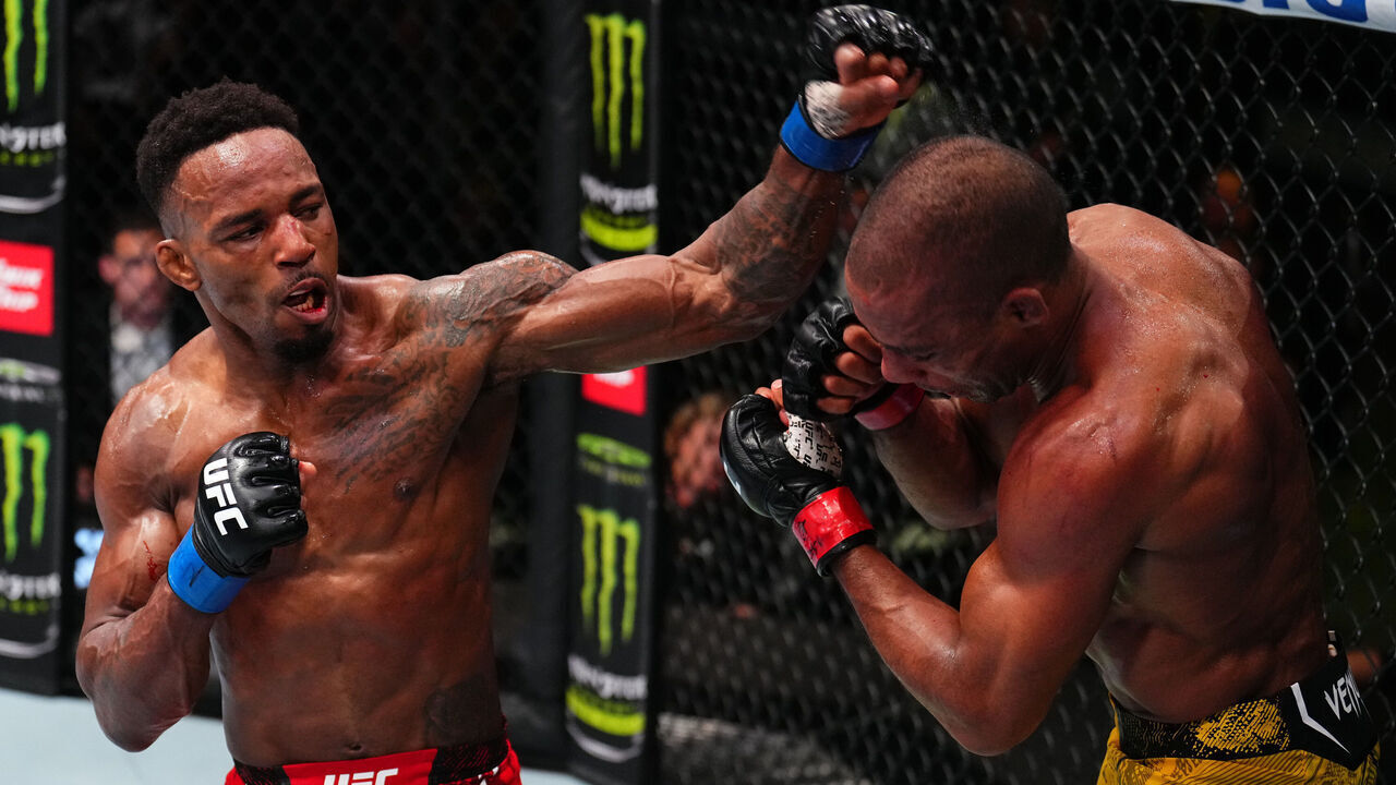 LAS VEGAS, NEVADA - MAY 18: (L-R) Lerone Murphy of England and Edson Barboza of Brazil trade punches in a featherweight fight during the UFC Fight Night event at UFC APEX on May 18, 2024 in Las Vegas, Nevada.