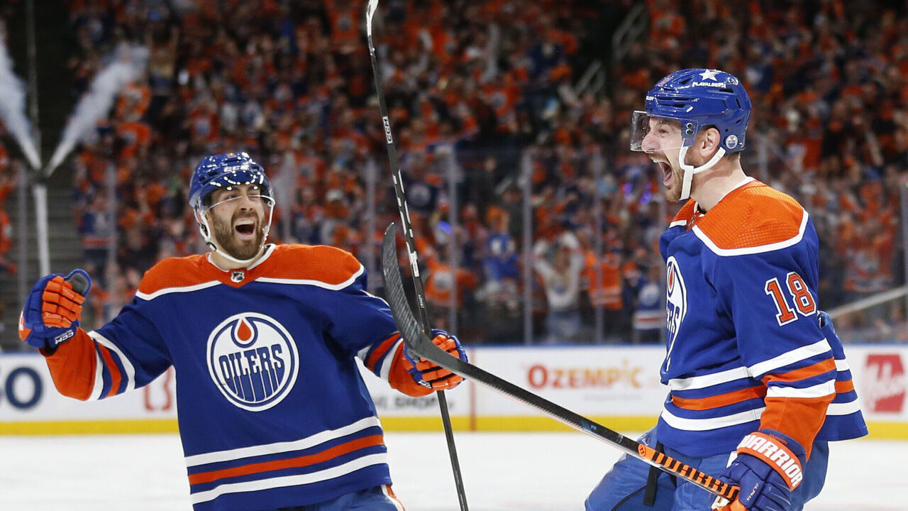 EDMONTON, ALBERTA - MAY 18: Zach Hyman #18 of the Edmonton Oilers celebrates a goal with Evan Bouchard #2 during the second period against the Vancouver Canucks in Game Six of the Second Round of the 2024 Stanley Cup Playoffs at Rogers Place on May 18, 2024 in Edmonton, Alberta.