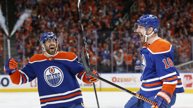 EDMONTON, ALBERTA - MAY 18: Zach Hyman #18 of the Edmonton Oilers celebrates a goal with Evan Bouchard #2 during the second period against the Vancouver Canucks in Game Six of the Second Round of the 2024 Stanley Cup Playoffs at Rogers Place on May 18, 2024 in Edmonton, Alberta.