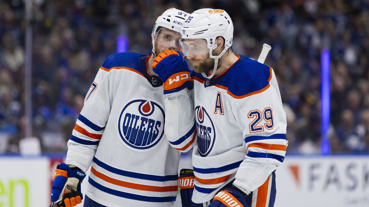 VANCOUVER, BC - MAY 08: Edmonton Oilers Centre Connor McDavid (97) discusses play tactics with teammate Leon Draisaitl (29) during Game Two of the Second Round of the 2024 Stanley Cup playoffs between the Edmonton Oilers and the Vancouver Canucks on May 10, 2024, at Rogers Arena in Vancouver, B.C.