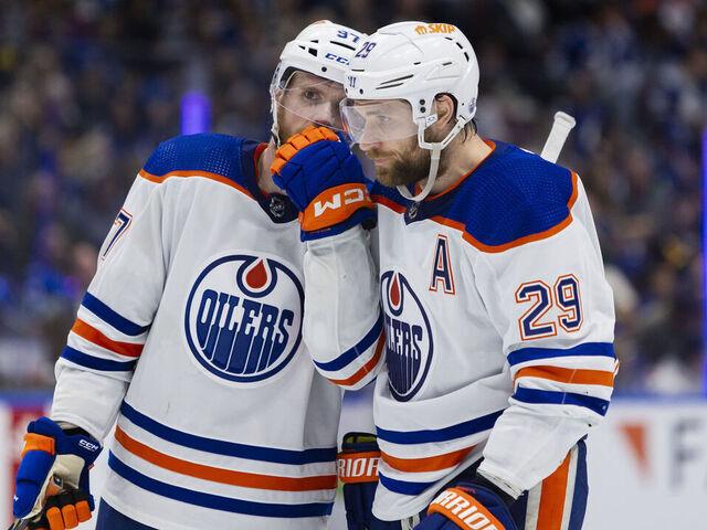 VANCOUVER, BC - MAY 08: Edmonton Oilers Centre Connor McDavid (97) discusses play tactics with teammate Leon Draisaitl (29) during Game Two of the Second Round of the 2024 Stanley Cup playoffs between the Edmonton Oilers and the Vancouver Canucks on May 10, 2024, at Rogers Arena in Vancouver, B.C.