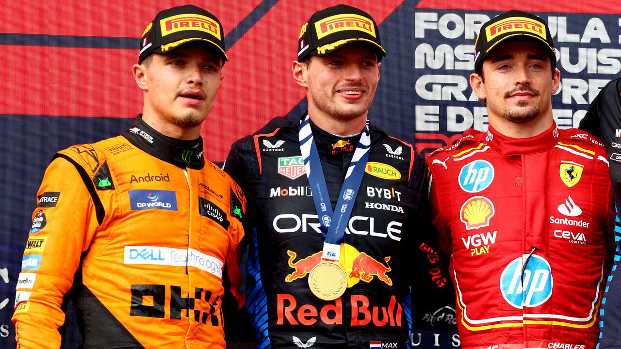 IMOLA, ITALY - MAY 19: Race winner Max Verstappen of the Netherlands and Oracle Red Bull Racing, Second placed Lando Norris of Great Britain and McLaren, Third placed Charles Leclerc of Monaco and Ferrari and David Morgan, Aero Trackside Performance Team Leader at Oracle Red Bull Racing celebrate on the podium during the F1 Grand Prix of Emilia-Romagna at Autodromo Enzo e Dino Ferrari Circuit on May 19, 2024 in Imola, Italy.