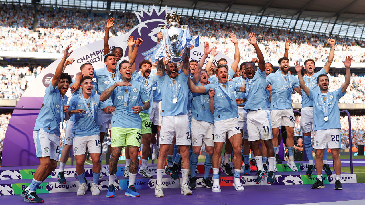 MANCHESTER, ENGLAND - MAY 19: Kyle Walker of Manchester City lifts the Premier League Trophy after their team's victory during the Premier League match between Manchester City and West Ham United at Etihad Stadium on May 19, 2024 in Manchester, England.
