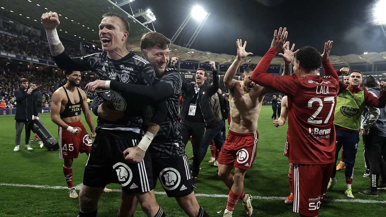 Stade Brestois' players celebrate winning the French L1 football match between Toulouse (TFC) and Stade Brestois 29 (Brest) and qualifying for the Champions League at the Stadium TFC in Toulouse, south-western France, on May 19, 2024.