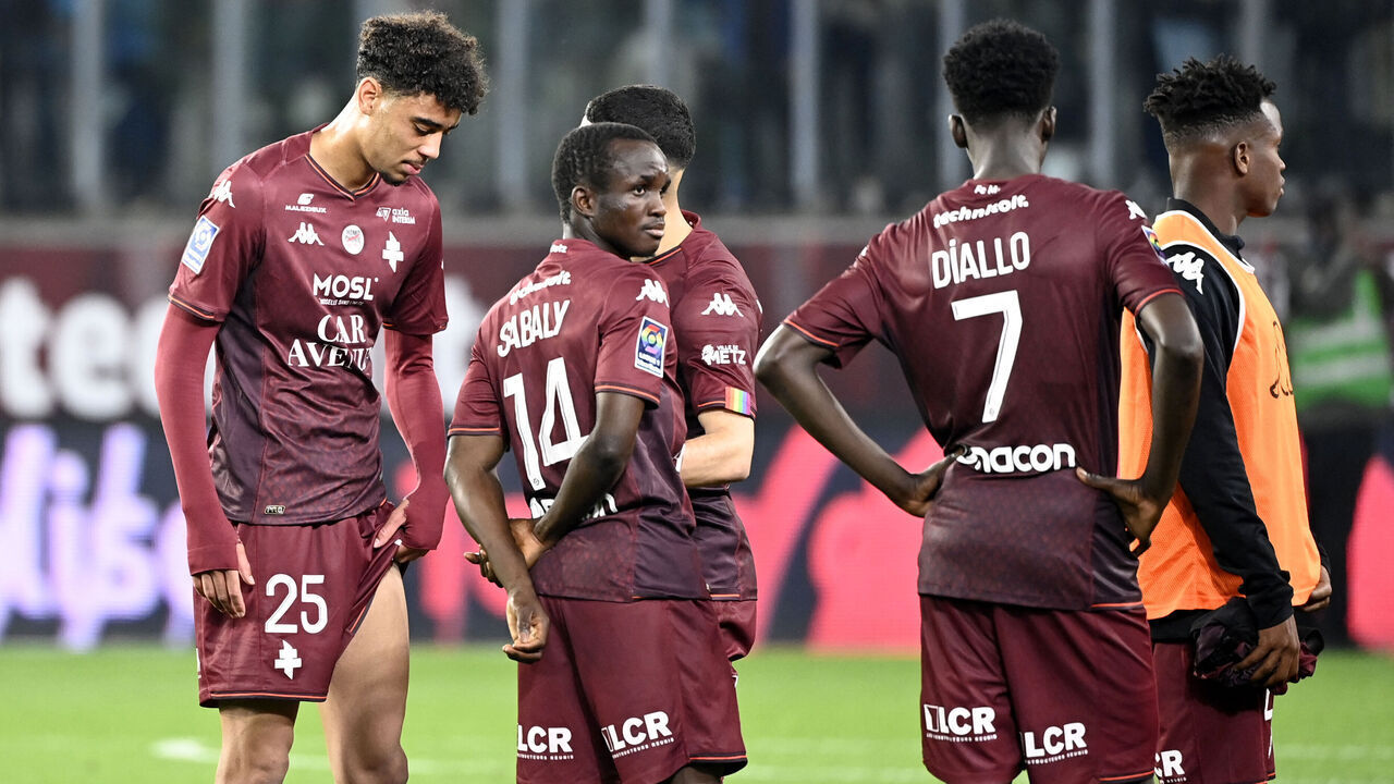 Metz' players react at the end of the French L1 football match between FC Metz and Paris Saint-Germain (PSG) at the Saint-Symphorien Stadium in Longeville-les-Metz, eastern France, on May 19, 2024.