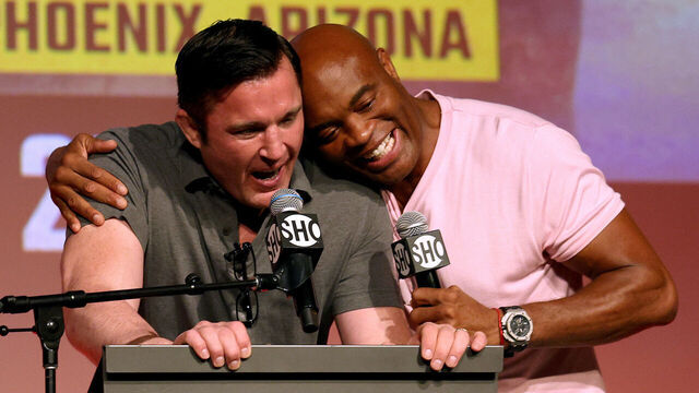HOLLYWOOD, CALIFORNIA - SEPTEMBER 12: Chael Sonnen receives a hug from Anderson Silva during a Jake Paul v Anderson Silva press conference at NeueHouse Hollywood on September 12, 2022 in Hollywood, California.