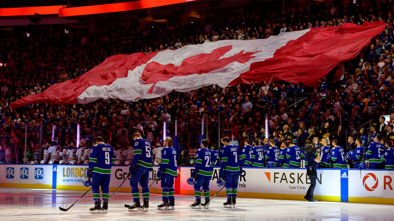 VANCOUVER, CANADA - MAY 16: The Vancouver Canucks and Edmonton Oilers listen to the anthem prior to Game Five of the Second Round of the 2024 Stanley Cup Playoffs at Rogers Arena on May 16, 2024 in Vancouver, British Columbia, Canada.