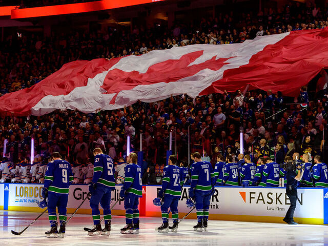 VANCOUVER, CANADA - MAY 16: The Vancouver Canucks and Edmonton Oilers listen to the anthem prior to Game Five of the Second Round of the 2024 Stanley Cup Playoffs at Rogers Arena on May 16, 2024 in Vancouver, British Columbia, Canada.