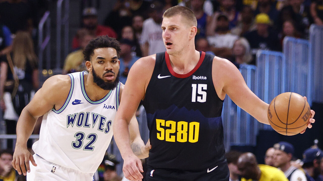 DENVER, COLORADO - MAY 19: Nikola Jokic #15 of the Denver Nuggets looks to pass against Karl-Anthony Towns #32 of the Minnesota Timberwolves during the third quarter in Game Seven of the Western Conference Second Round Playoffs at Ball Arena on May 19, 2024 in Denver, Colorado.