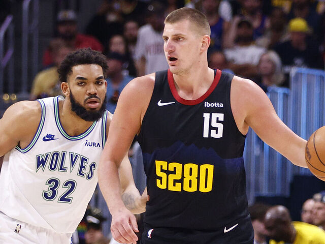 DENVER, COLORADO - MAY 19: Nikola Jokic #15 of the Denver Nuggets looks to pass against Karl-Anthony Towns #32 of the Minnesota Timberwolves during the third quarter in Game Seven of the Western Conference Second Round Playoffs at Ball Arena on May 19, 2024 in Denver, Colorado.