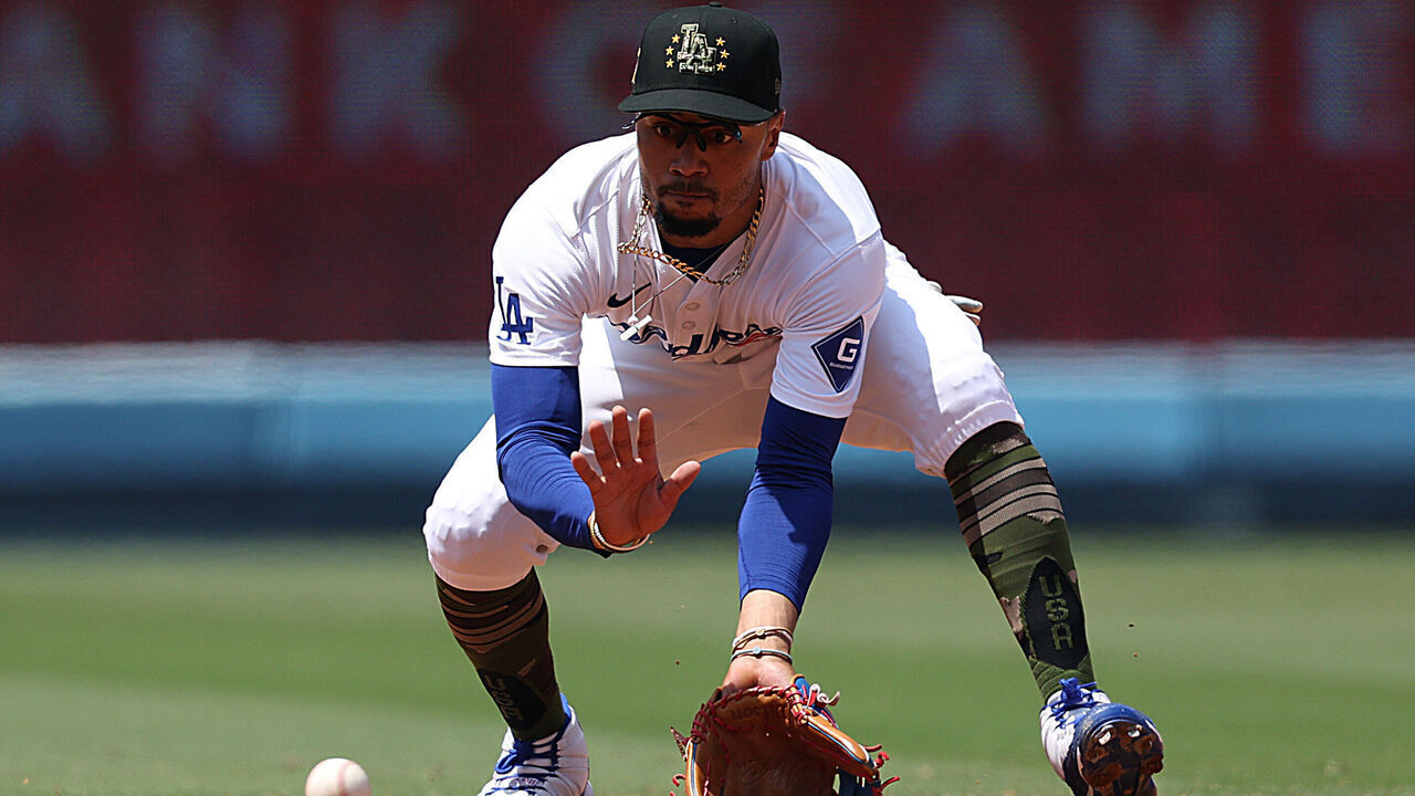 LOS ANGELES, CALIFORNIA - MAY 19: Mookie Betts #50 of the Los Angeles Dodgers fields a ground ball for an out during a 3-1 win over the Cincinnati Reds at Dodger Stadium on May 19, 2024 in Los Angeles, California.