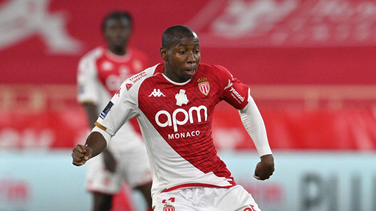 Monaco's Malian midfielder #04 Mohamed Camara (L) passes the ball during the French L1 football match between AS Monaco and FC Nantes at the Louis II Stadium (Stade Louis II) in the Principality of Monaco on May 19, 2024.