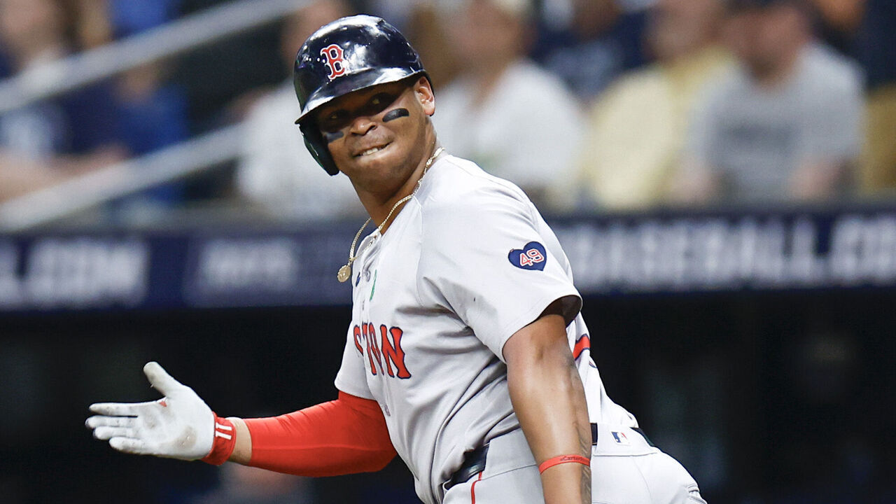 ST PETERSBURG, FLORIDA - MAY 20: Rafael Devers #11 of the Boston Red Sox reacts after hitting a two run home run during the third inning against the Tampa Bay Rays continuing his home run streak to six games in a row at Tropicana Field on May 20, 2024 in St Petersburg, Florida.