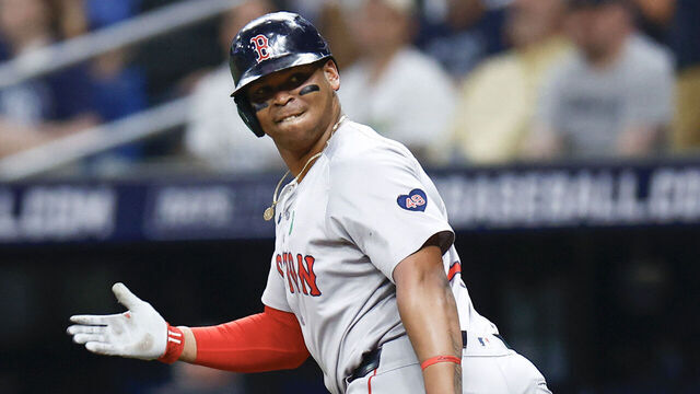 ST PETERSBURG, FLORIDA - MAY 20: Rafael Devers #11 of the Boston Red Sox reacts after hitting a two run home run during the third inning against the Tampa Bay Rays continuing his home run streak to six games in a row at Tropicana Field on May 20, 2024 in St Petersburg, Florida.