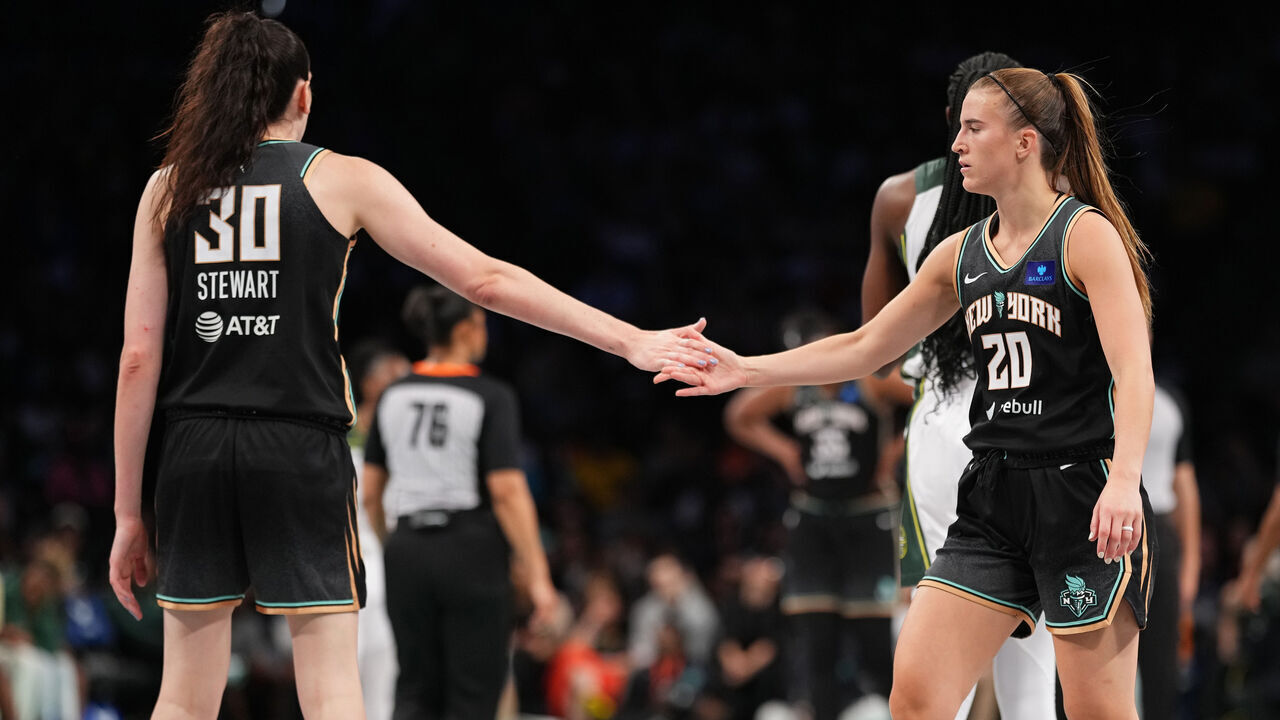 BROOKLYN, NY - MAY 20: Breanna Stewart #30 and Sabrina Ionescu #20 of the New York Liberty high five during the game against the Seattle Storm on May 20, 2024 at Barclays Center in Brooklyn, New York. Mandatory Copyright Notice: Copyright 2024 NBAE