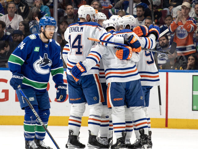 VANCOUVER, CANADA - MAY 20: Evan Bouchard #2 of the Edmonton Oilers celebrates his goal with teammates during the second period in Game Seven of the Second Round of the 2024 Stanley Cup Playoffs against the Vancouver Canucks at Rogers Arena on May 20, 2024 in Vancouver, British Columbia, Canada.