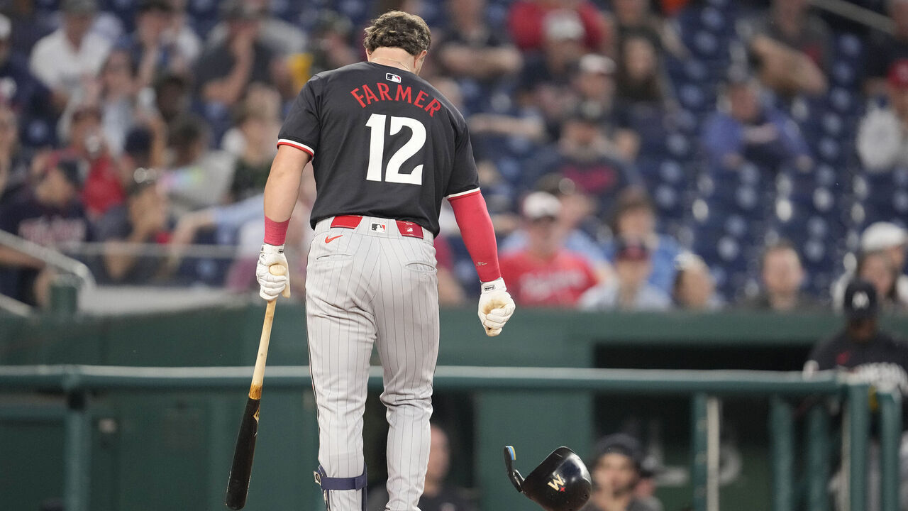 WASHINGTON, DC - MAY 20: Kyle Farmer #12 of the Minnesota Twins walks back to dug out after striking out in sixth inning the during a baseball game against the Washington Nationals at Nationals Park on May 20, 2024 in Washington, DC.