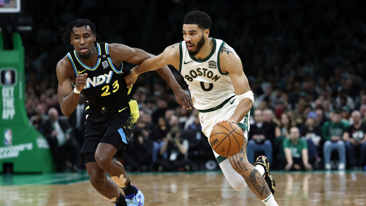 Boston, MA - January 30: Boston Celtics SF Jayson Tatum drives past Indiana Pacers SF Aaron Nesmith in the second quarter. The Celtics beat the Pacers, 129-124.