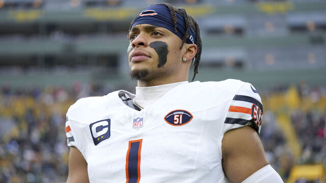 GREEN BAY, WI - JANUARY 7: Quarterback Justin Fields #1 of the Chicago Bears stretches prior to an NFL football game against the Green Bay Packers at Lambeau Field on January 7, 2024 in Green Bay, Wisconsin. The Packers beat the Bears 17-9.