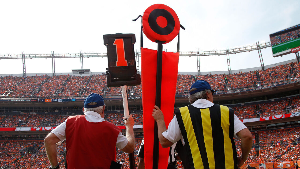 DENVER, CO - SEPTEMBER 13: The chain gang works the sticks on the sidelines as the Baltimore Ravens face the Denver Broncos at Sports Authority Field at Mile High on September 13, 2015 in Denver, Colorado. The Broncos defeated the Ravens 19-13.