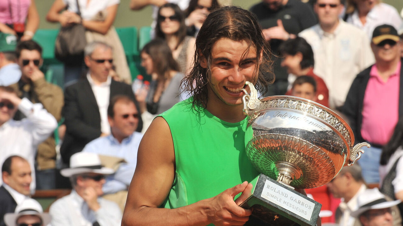 Rafael Nadal (ESP) celebrates with the trophy after winning the 2008 French Open final against Roger Federer (SUI).